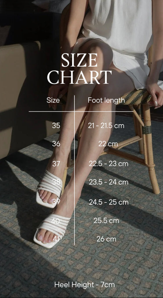 Size chart for shoes with a person wearing white sandals on a textured floor. black brown