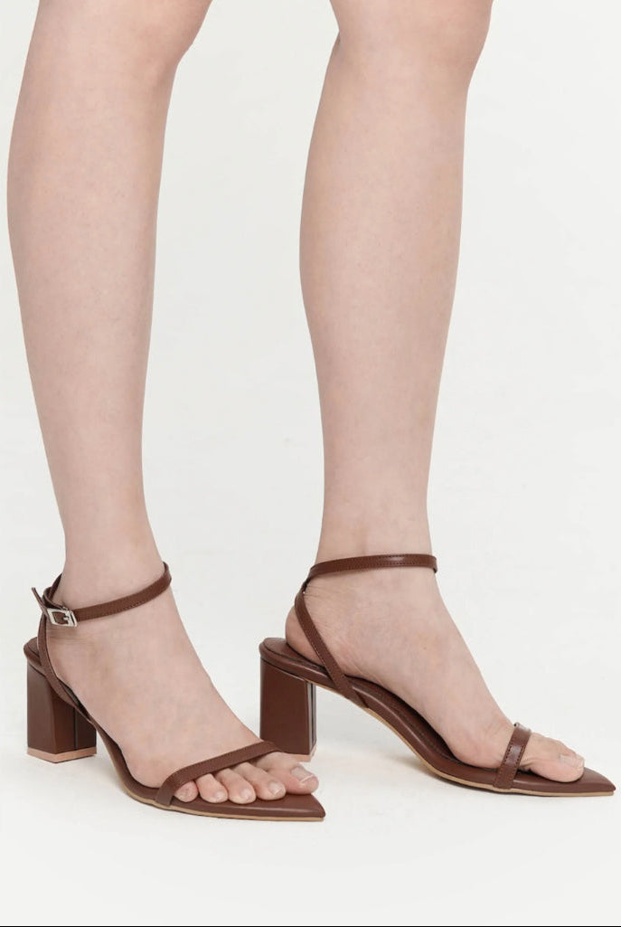 dark Brown block-heel sandals worn with sheer tights 